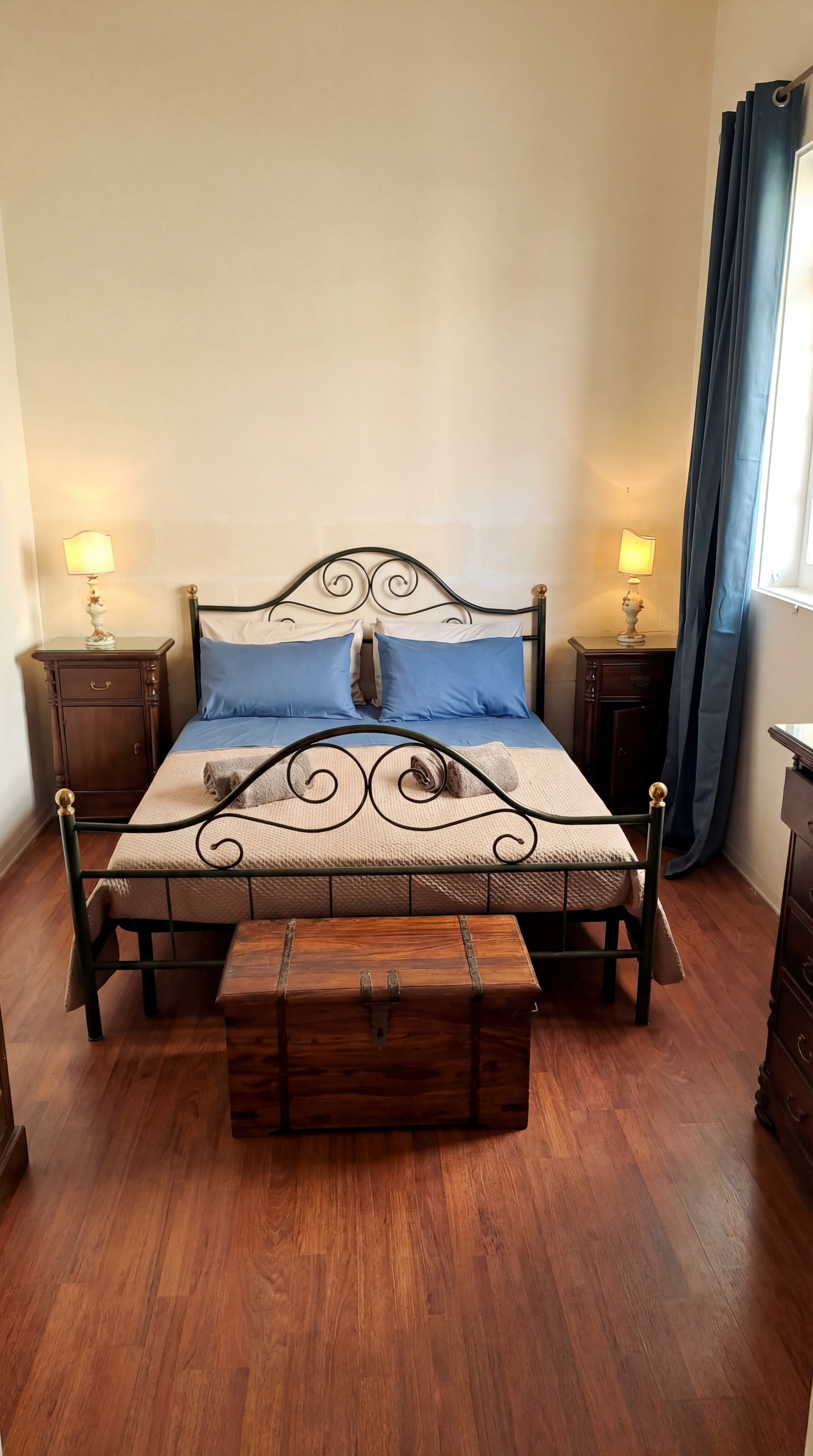 Master bedroom with limestone walls and natural light