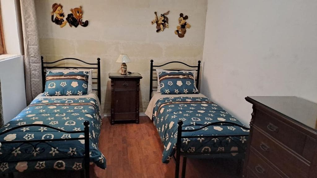 Twin room with two single beds, family friendly decor